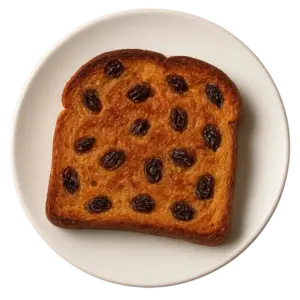 A slice of Waffle House raisin toast topped with plump raisins, showcasing a golden-brown crust.